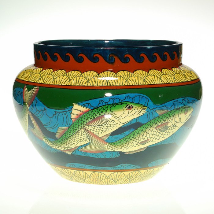 Rhead Foley Intarsio“fish” jardiniere, 7 1/8" x 10 1/4”: Foley (Wileman & Company) Intarsio jardiniere with bold and colorful fish, designed by Frederick Alfred Rhead. The jard is a veritable rainbow of colors and intricate designs. Marked with the “Foley