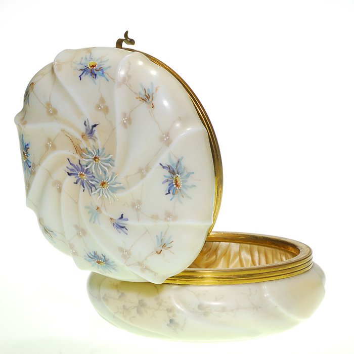 Wavecrest dresser box, blue daisies, 4”X7”, sticker: Wavecrest dresser box hand decorated with light and dark blue daisies among shadow gray foliage on a Helmschmied Swirl molded cover and base. Enameling highlights the artistic design. Height 4 inches,