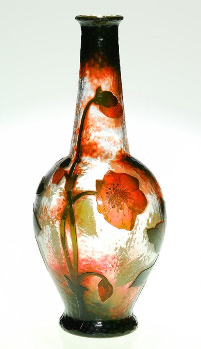Daum Nancy Martele’ vase, floral, 11 7/8”, signed: Regal Daum Nancy Martelé vase exhibiting several life size flower heads and buds nodding from thick lengthy stems alternating with ovate foliage. The plants are arranged over a nice “hammered” su