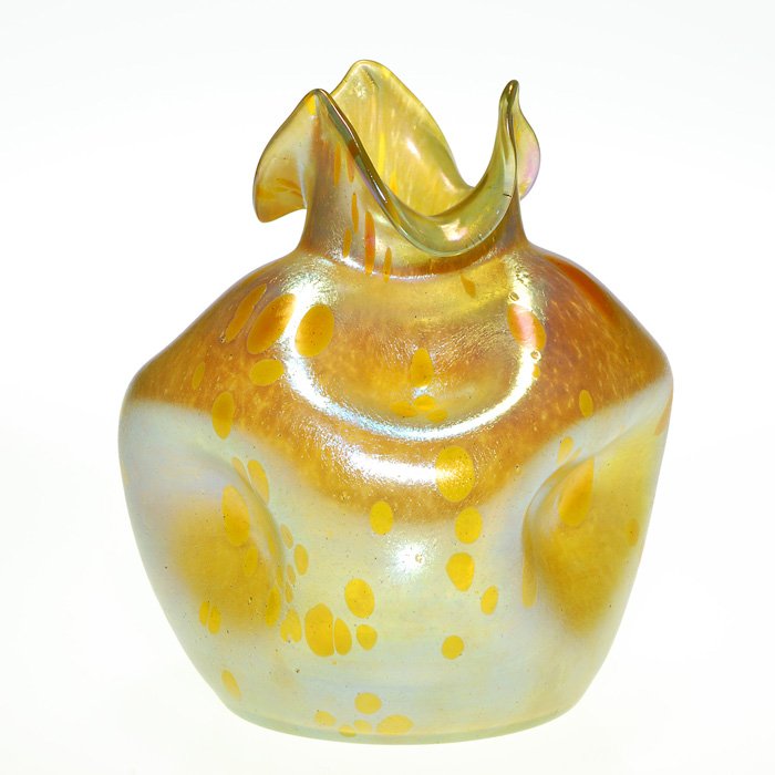 Loetz Asträa vase, gold, pinched, pulled rim, 7 1/4”: Handsome Loetz vase, the bright gold surface attractively displaying the bubbly honey color Asträa pattern. The artist evenly distorted the plump body and artfully sculpted a trio of peaks at the rim