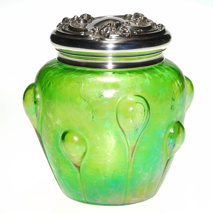 Loetz Creta Papillon humidor, silver cover, 6 3/4”: Loetz “Creta Papillon” humidor surrounded with “blow out” teardrops and topped with a silver cover highly embossed. Height 6 3/4 inches. If you don’t smoke it makes a fine container for swee