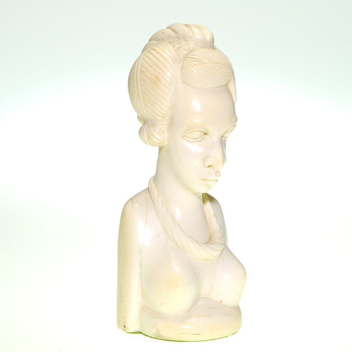 Carved ivory woman, 8 1/2”, Liberia ca 1952: Carved Liberian ivory bust of a nude African woman, her hair neatly arranged and wearing a necklace, circa 1952. Height 8 1/2 inches. Natural lines and patina. Purchased in Liberia in 1952 by a member