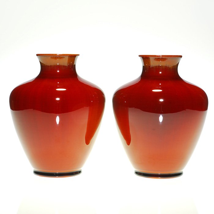 Pair of Rookwood Coromandel vases, 1937, 7 1/4”: Rookwood pair of 7 1/4 inch vases covered in a nice Coromandel glaze produced in 1937. Marks include the Rookwood logo, date and shape number 6311. Each has the molded guide ring on the bottom. There