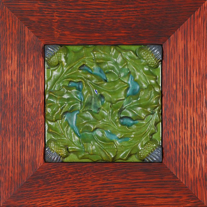 Rookwood Architectural tile, thistles, 7 3/4” square: Rookwood Faience 7 3/4 inch square architectural tile with thistles that has been covered in blue and green mat glazes. Marked Rookwood Faience on the back and in a Dard Hunter custom oak frame. There