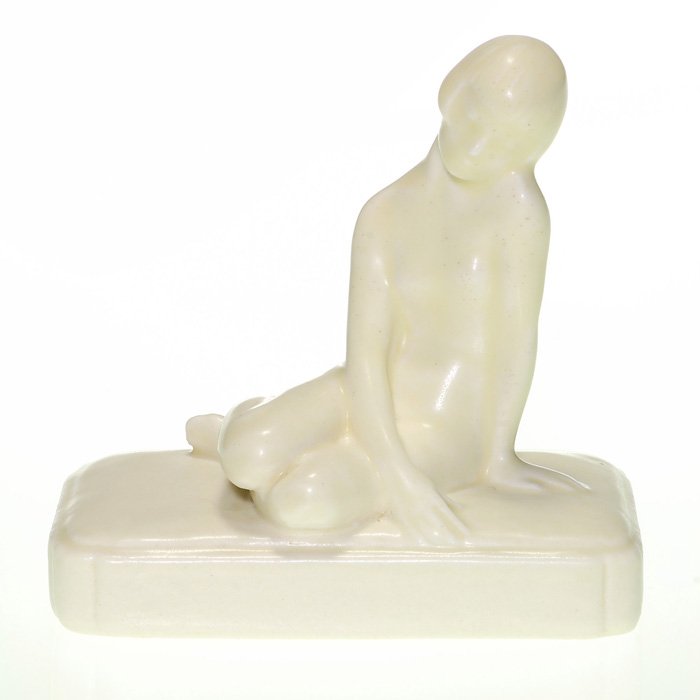Rookwood Nude paperweight, 1928, 4 1/2”, Ivory: Rookwood seated nude paperweight, a Louise Abel design, cast in 1928 and covered in the Ivory Mat glaze. Height is 4 1/2 inches. Marks include the Rookwood logo, date, shape 2868 and the artist’s mo