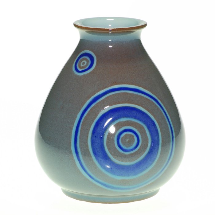 Rookwood vase, Wareham, 1952, 6 1/4”: Rookwood 6 1/4 inch hand-thrown vase, decorated with light and dark blue circles against a gray background, by John Dee Wareham in 1952. Marks include the Rookwood logo, date and Mr. Wareham’s incis