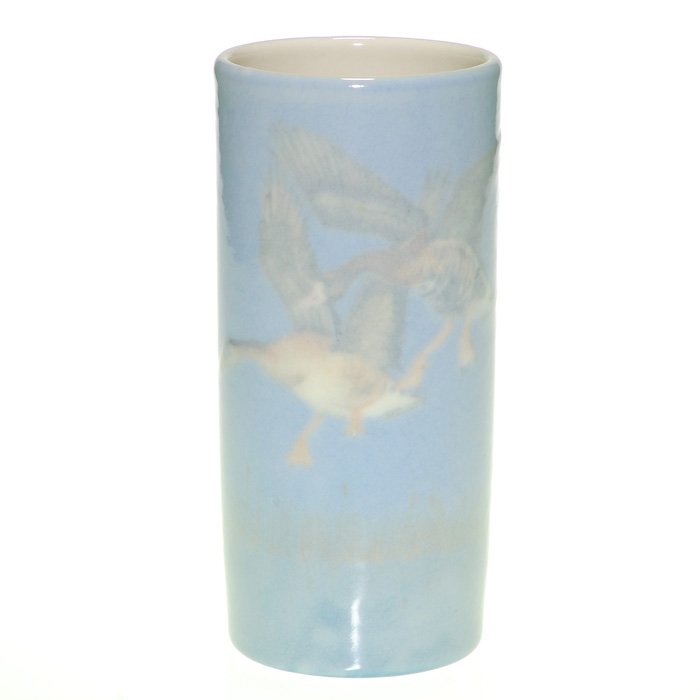 Rookwood Porcelain vase, birds, Ley, 6 7/8”: Rookwood porcelain vase decorated by Kay Ley showing a pair of geese landing with a row of cattails encircling the piece. Marks include the Rookwood logo, the 1945 date, shape 1124E and “4232” inc