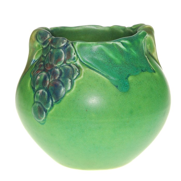 Carved Mat vase, grapes, Mitchell, 1905, 4 3/8”: Rookwood Mat glaze vase with applied and deeply carved grapes, leaves and stems done in 1905 by Marianne Mitchell. A very Arts & Crafts work, the vase appears to have handles but these are the applied