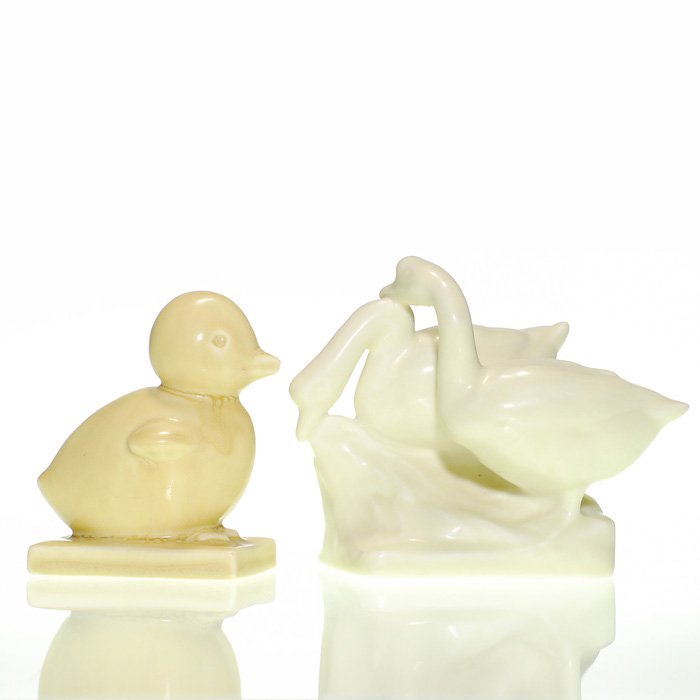 2 Rookwood paperweights: 6169 Chick, 1855 Geese: Lot of two paperweights. 1. A 3 1/2 inch Chick, a Louise Abel design, cast in 1932 and covered with a pale tan mat glaze. Impressed with the Rookwood logo, the date, shape 6169 and the designer’s mo