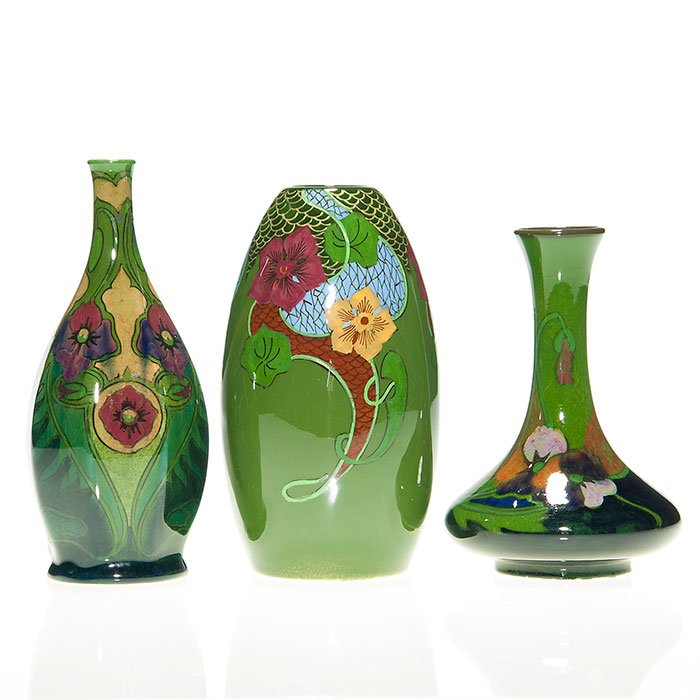 3 Zuide Gouda high glaze vases, tallest 6 3/8”: Three miniature Zuide Gouda high glaze vases showing artistic floral design. Tallest 6 3/8 inches. All hand marked Zuide Holland along with other marks. Faint crazing.