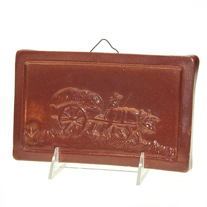 WPA North Dakota “Transportation Series” plaque: North Dakota “Transportation Series” plaque featuring an oxcart done during the Great Depression in the late 1930’s. Marked “WPA Ceramics N. Dak” in black on the back. Size is 4 3/4 inches b