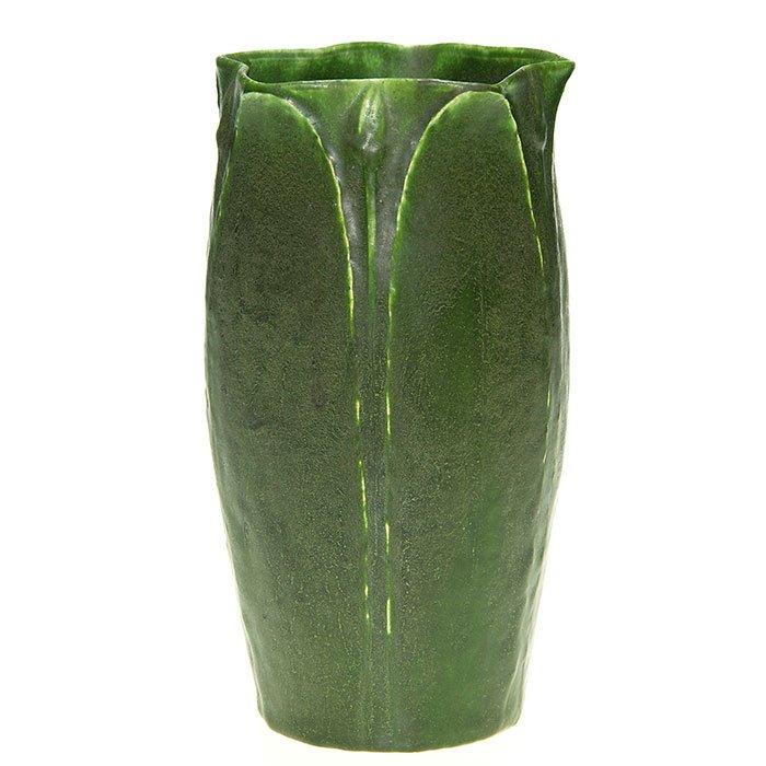 Grueby vase, tooled leaves, Post, 7 3/4”: Grueby vase with tooled leaves, done by Wilhelmine Post and covered in the signature green mat glaze. Impressed Grueby logo, shape number 75 and the incised initials of Ms. Post. Height is 7 3/4 inche