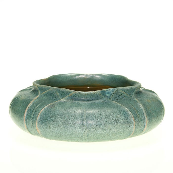 Grueby low bowl with leaves, blue mat, 2” x 6”: Grueby low bowl with a carved leaf design and covered in a blue mat glaze. There is no crazing but the glaze is thin in a couple of areas. Size is 2 inches high by 6 inches in diameter. Marks include