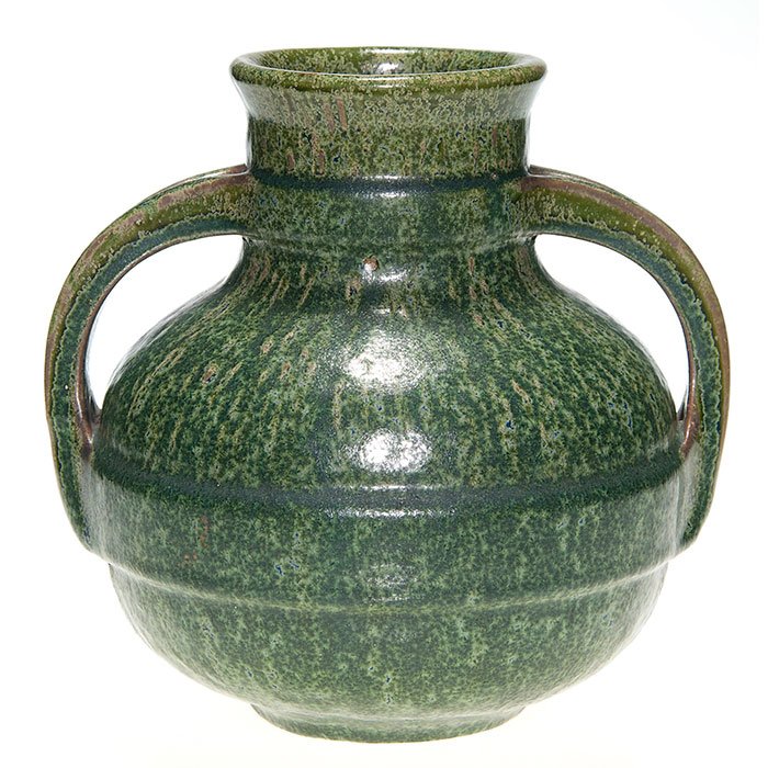 Fulper twin handled vase,cucumber crystalline,8 3/8”: Fulper Pottery twin handled vase covered in the Cucumber crystalline glaze which seems to have been applied a bit heavier than usual causing the glaze to be of a darker green than typically seen. Ther