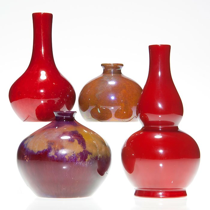 4 Bernard Moore gourd vases, 2 red, tallest 7 1/4”: Four Bernard Moore gourd vases. Two red vases measure 7 1/4 inches and 5 3/8 inches. Two squatty glaze effect vases measure 4 inches and 3 inches. All marked either with the full name or the initials