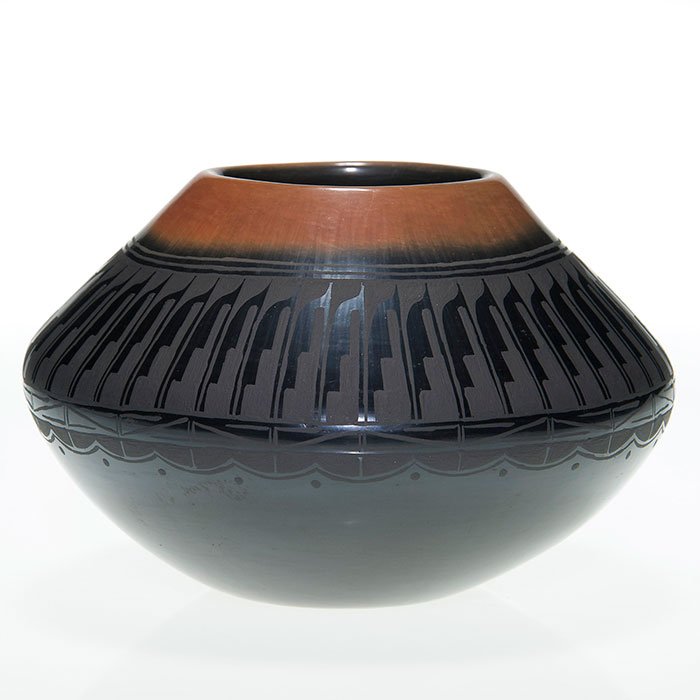Robert Naranjo Santa Clara vase, feathers, 3 5/8”: Robert Naranjo (Santa Clara Pueblo) carved vase from 1996 having a brown rim over the traditional two tone black body with a band of beautifully detailed feathers. Incised “Robert Naranjo SCP 8/96��