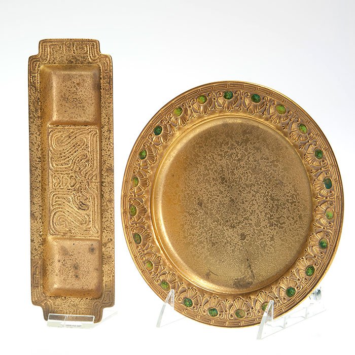 2 Tiffany bronze doré: pen holder & enamel tray: Two Tiffany bronze gold doré: First an 8 1/8 inch circular tray with enamel decor, impressed “Louis C. Tiffany Furnaces, Inc, Favrile 309” and circular Tiffany logo. Second a 3 inch by 9 1/2 inch