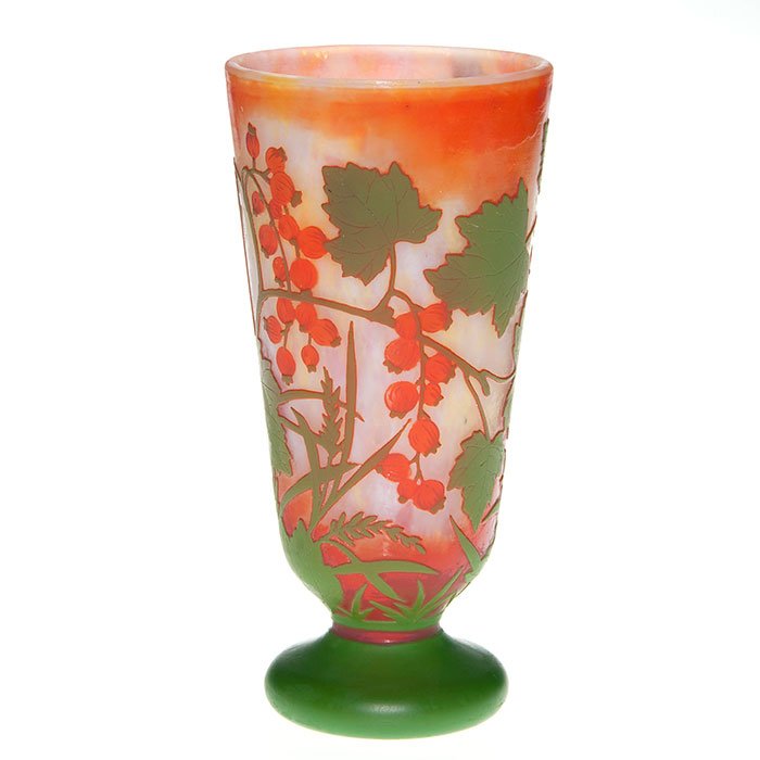 Daum Nancy cameo vase, berry vine, 8”, signed: Good Daum Nancy vase on bun foot, the body cameo decorated with orange berries produced on a green leafy vine and displayed over a mottled yellow, pink and orange backdrop. Height 8 inches. Cameo sign