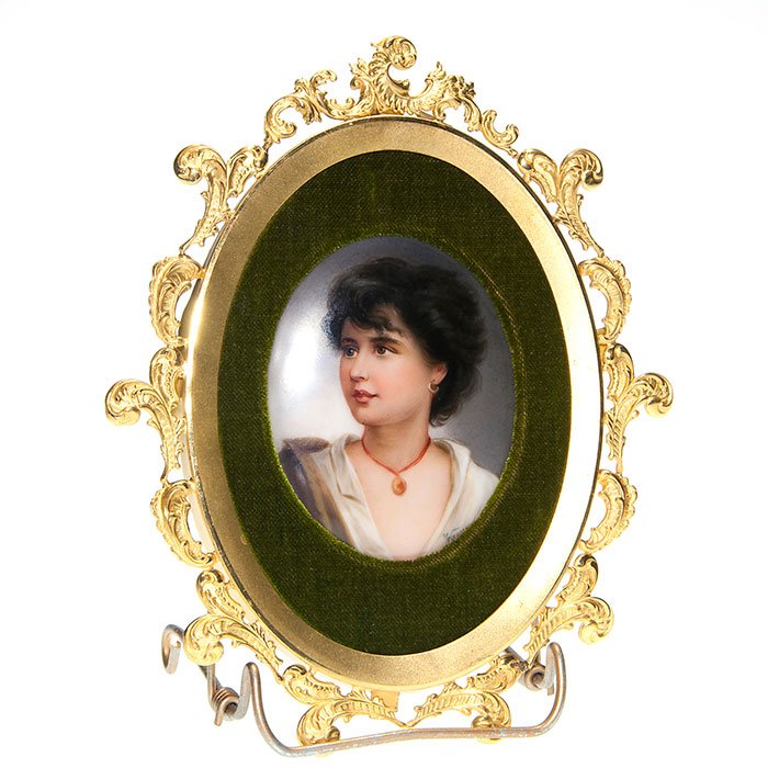 Berlin porcelain, Wagner portraiture, 2 3/4”X3 1/2”: Oval Berlin porcelain, signed Wagner and characterized with the portraiture of a gypsy girl with short black hair and wearing an earring and about her neck, a locket. Measures 2 3/4 inches by 3 1/2 in