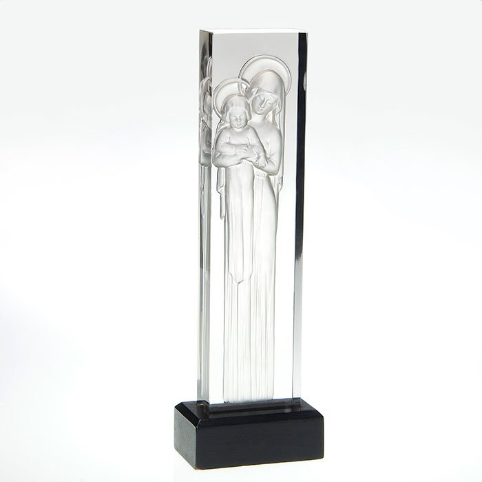 Lalique Madonna & Child intaglio carved, 13 3/8”, sig: Lalique statuette intaglio carved with Madonna and Child both in graceful lengthy gowns. The 13 3/8 inch by 1 1/2 inch sculpture is fitted into the original black wood base. Script engraved “Lalique