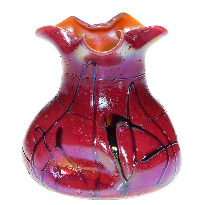 Pallme Konig vase, red, tri -con rim, 4 3/4”: Nice red Pallme-Konig vase with a beautiful high fire finish. Of bag form with three dimples and blackened “squiggle” inlay and a fold inward tri-con rim exposing a cased golden caramel interior. 