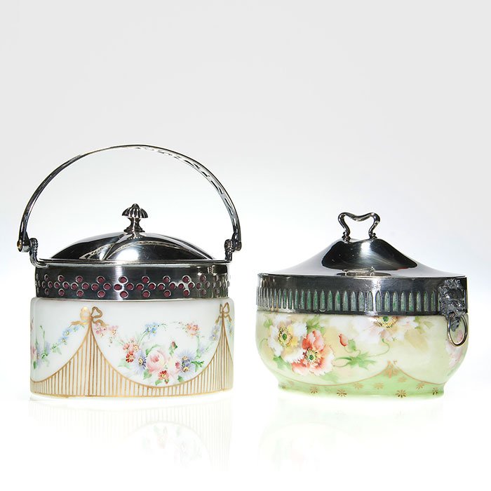 2 Pairpoint biscuit containers, silver plate collar &: Two Pairpoint opalware containers for sweet biscuits, hand decorated with either poppies or flowers from a Victorian garden. Pierced silver plate collars, one has a pierced handle. Both covers are mar