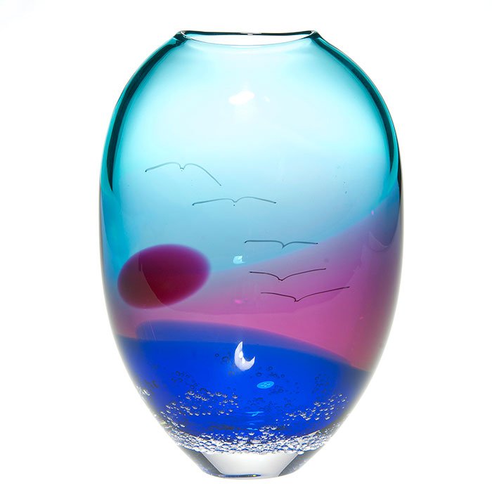 Buzz Blodgett vase, Moon, ocean, gulls, 9 3/4”, ‘01: Handsome Waldo “Buzz” Blodgett vase showing a tranquil evening scene, the sun about to set over a body of water, overhead sea gulls are on the wing and from the bottom tiny bubbles rise. Height 9 