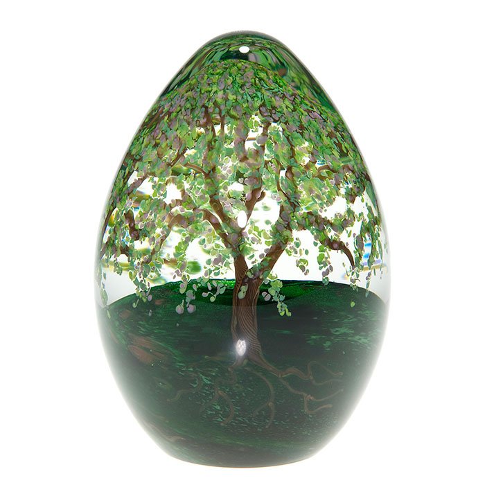 Cathy Richardson paperweight, spring, 4 7/8”, ‘05: Cathy Richardson “ostrich egg” paperweight showing a trio of trees arrayed with springtime blossoms and fresh foliage and having aventurine stepping stones beckoning you to take a walk in the gree