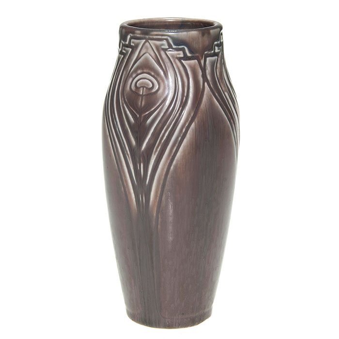 Rookwood mat production vase, peacock feathers, 7”: Rookwood mat glaze production vase with three peacock feathers done in 1919 under a rich, crystalline purple glaze. Marks include the company logo, the date and shape number 2121. Height 7 inches. The