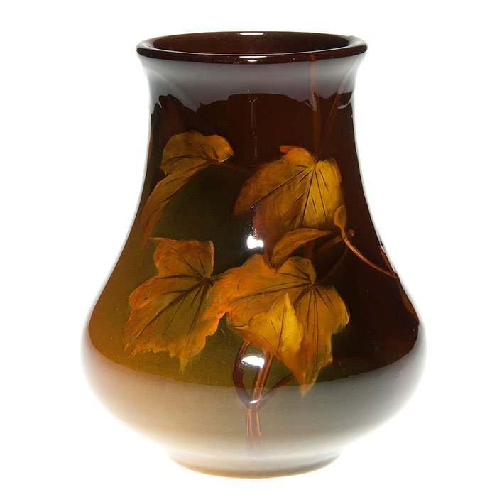Rookwood Standard, maple leaves, Steinle, 5 1/2”: Standard Glaze 5 1/2 inch vase decorated with maple leaves, the work of Carrie Steinle in 1900. Marks include the Rookwood logo which indicates the date, shape 517D and the artist’s incised monogram