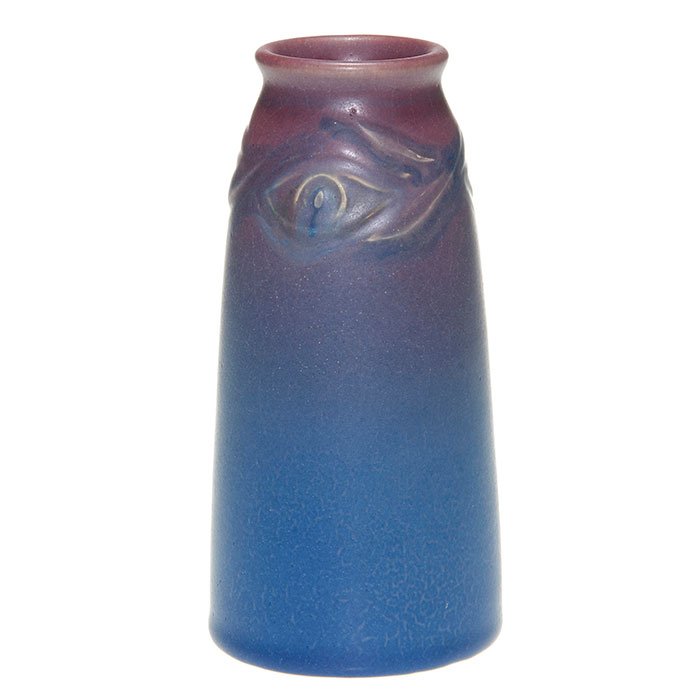Rookwood carved mat, peacock feather, CST, 6 3/8”: Carved Mat 6 3/8 inch vase with a repeating peacock feather design and covered with rose over blue mat glazes, the work of Charles Todd in 1913. Marks include the Rookwood logo, date, shape 1658F and 