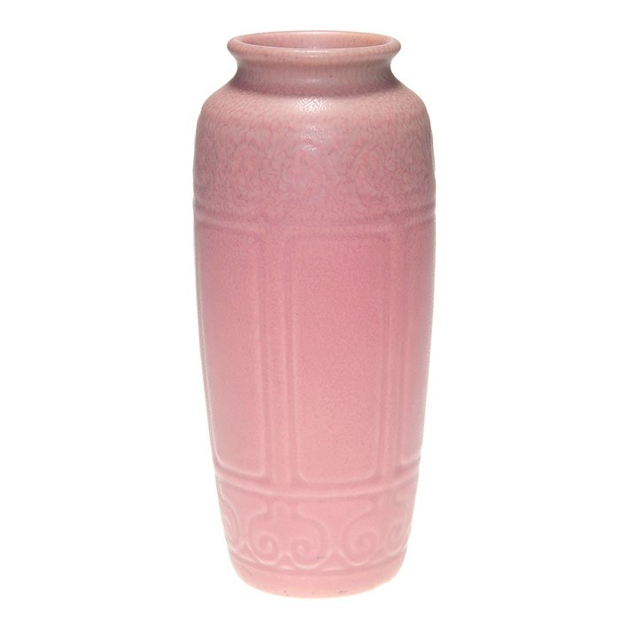 Rookwood pink mat production vase, 1929, 8 5/8”: Rookwood production vase done in a mottled pink mat glaze in 1929. The 8 5/8 inch vase has embossed floral patterns under the glaze. Marked with the company logo, the date and shape 2907. Uncrazed.