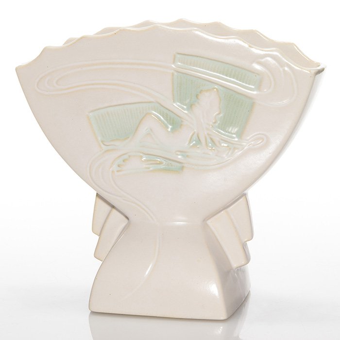 Roseville Silhouette vase, nudes, 783-7, 7 3/8”: Roseville Silhouette fan shaped vase in white with a reclining nude on either side. “Roseville U.S.A. 783-7” cast into the bottom. There is one tiny glaze nick on the body. Height is 7 3/8 inches.
