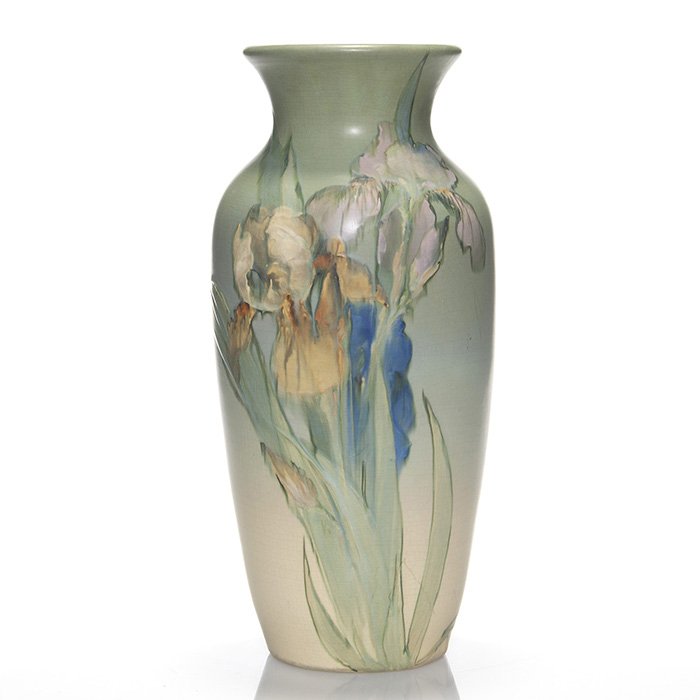 Weller Hudson, Timberlake, irises, 15”, marked: Tall Weller Hudson vase with a stand of yellow, pink and blue irises on the front and a yellow one at the base on the back painted and signed by Mae Timberlake. Height 15 inches. Color runs soften the