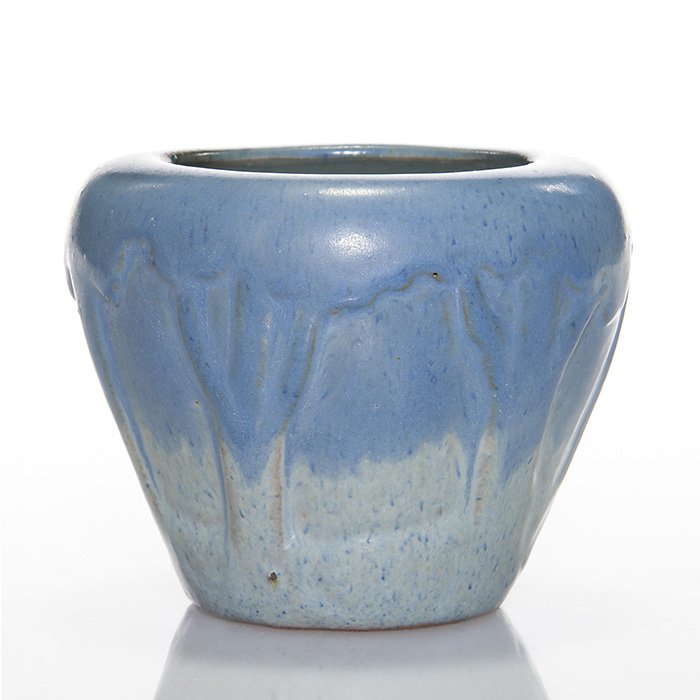 Arequipa carved scenic vase, 3 1/2”: Arequipa hand built scenic vase with deeply recessed areas between tree trunks. The interior glaze and lower half of the vase are done in a speckled light blue while the upper half is done in a medium