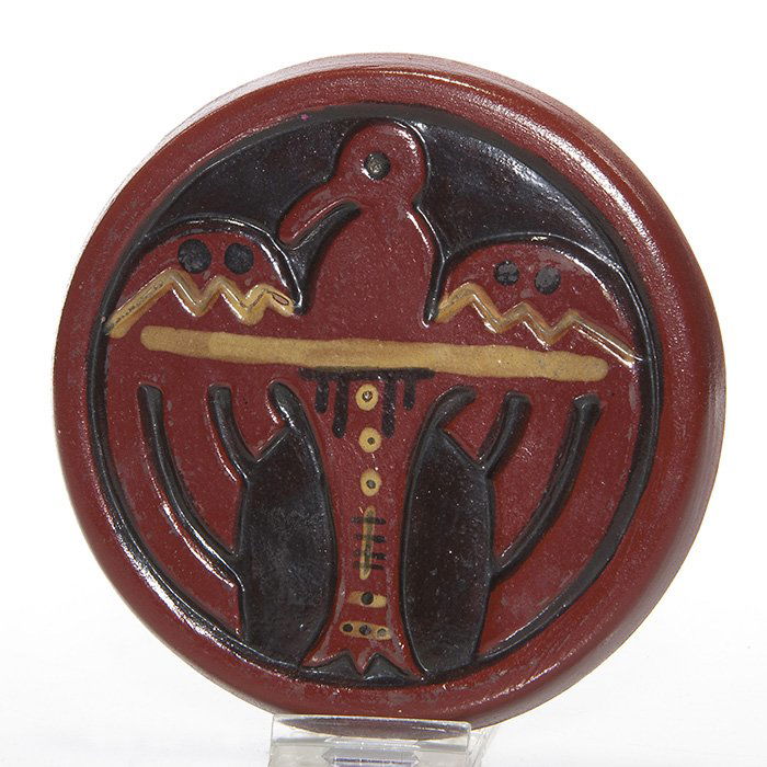 UND Bentonite trivet, Thunderbird, Mattson,5 1/2”: Handsome UND Bentonite Thunderbird trivet done by Julia Mattson, circa 1934. Marks include the circular UND ink stamp logo and the incised notation “JM 2062 Thunderbird” on the back. Diameter is 5