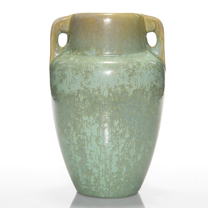 Fulper twin handled vase, green crystalline, 9”: Fulper Pottery twin handled vase covered in a light green snowflake crystalline glaze. Marked on the bottom with the Fulper “racetrack” ink stamp. Height is 9 inches. Excellent original condition.