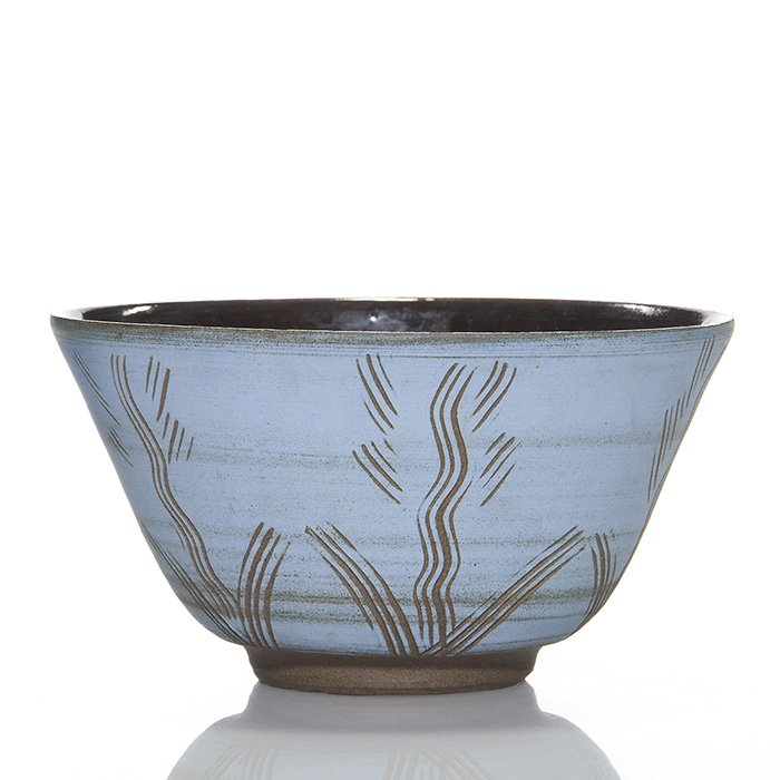 Early Scheier bowl, sgraffito flowers, 2 7/8”: Early Ed and Mary Scheier bowl with sgraffito decoration of simple flowers. Red clay with blue overglaze etched through with a stylus. Interior glazed. Signed “Scheier” on the bottom. Height is 2