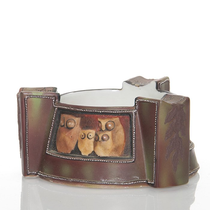 Nippon blown out “Owl” ashtray, 2 3/8” x 4 3/4”: Amusing Nippon blown out “Owl” ashtray featuring three panels, two with trees and one with four three dimensional owls looking sheepishly out at us. Three buttresses form a rest for one’s smokes