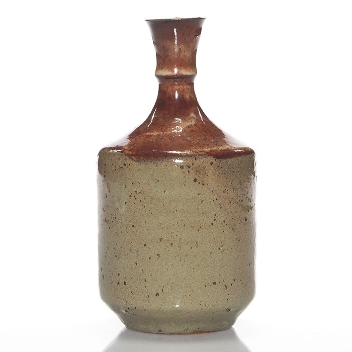 M. Wildenhain, Pond Farm Pottery vase, 6 3/4”: Pond Farm Pottery vase made by Marguerite Wildenhain, circa 1950. The thrown vase has a ruddy red glaze on the shoulder and neck. Incised “Pond Farm” and marked with the handled pitcher logo used