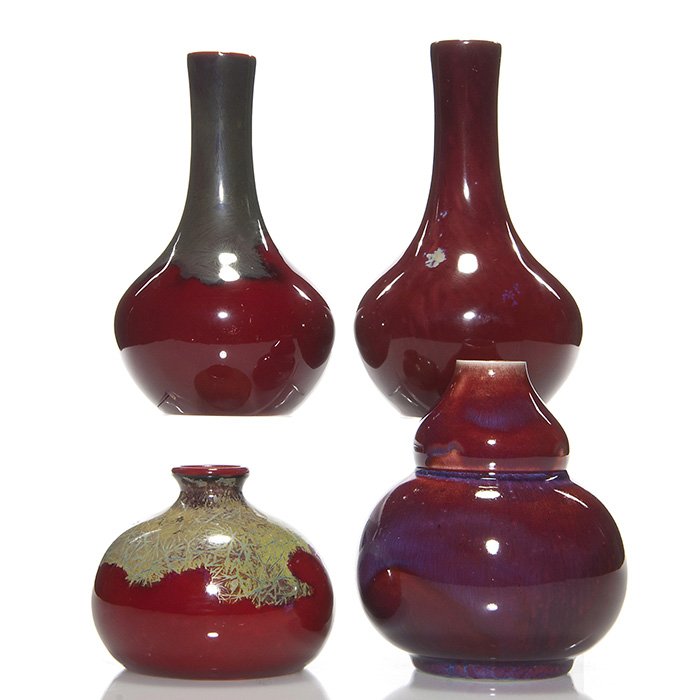 4 Bernard Moore flambe’ vases, tallest 5 5/8”: Four Bernard Moore vases, each covered in a red flambe’ glaze. Heights are 5 5/8 inches, 5 3/8 inches, 4 1/2 inches and 3 inches. Each is marked on the bottom. All in excellent original condition wi
