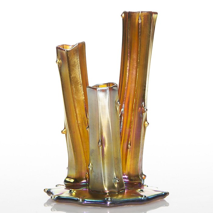 Steuben 3 prong stump vase, gold, 6 1/8”, signed: Fine golden Steuben stump vase with 3 prongs rising from a tooled circular base that bears the “Aurene” signature and 2744 shape number. Height 6 1/8 inches. Teensy 1/8 inch factory opening in the