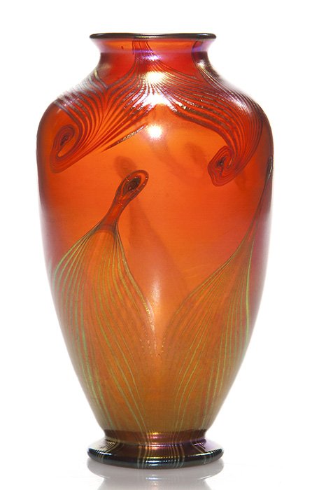 Tiffany red vase, pull feather design, 6 3/8”, signed: Good Tiffany vase, a lovely shade of golden red attractively decorated with coiled feathers combed over the shoulder and lengthy feathers pulled from the base. Height 6 3/8 inches. Engraved “L.C.T.�
