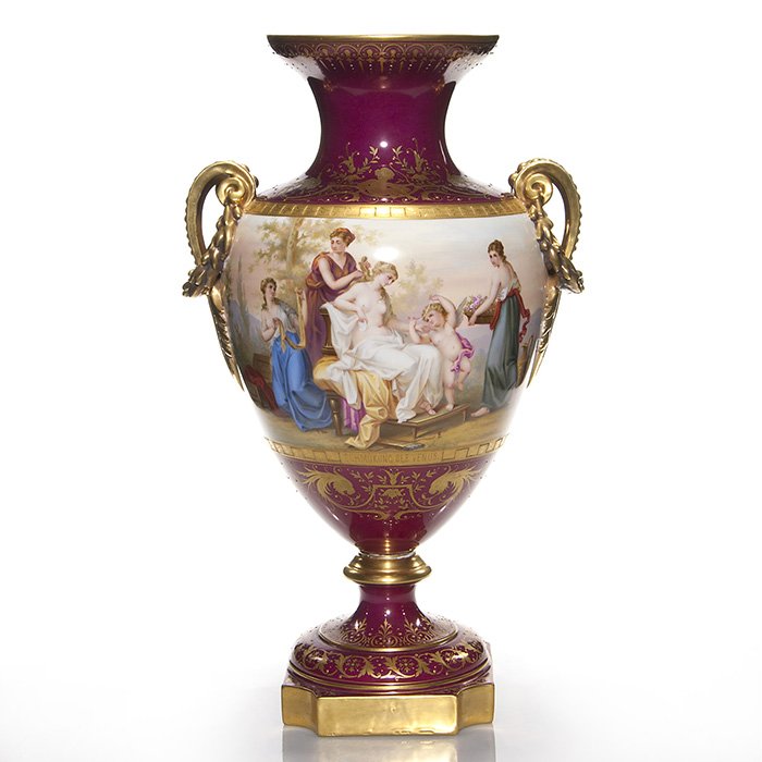 Royal Vienna urn, 21 1/2”, Beehive Austria, 2 pc: Impressive Royal Vienna handled urn depicted with the goddess Venus seated in a garden surrounded by her personal attendants and the visitation of a cherub gifting a necklace. The entitlement “Schmu