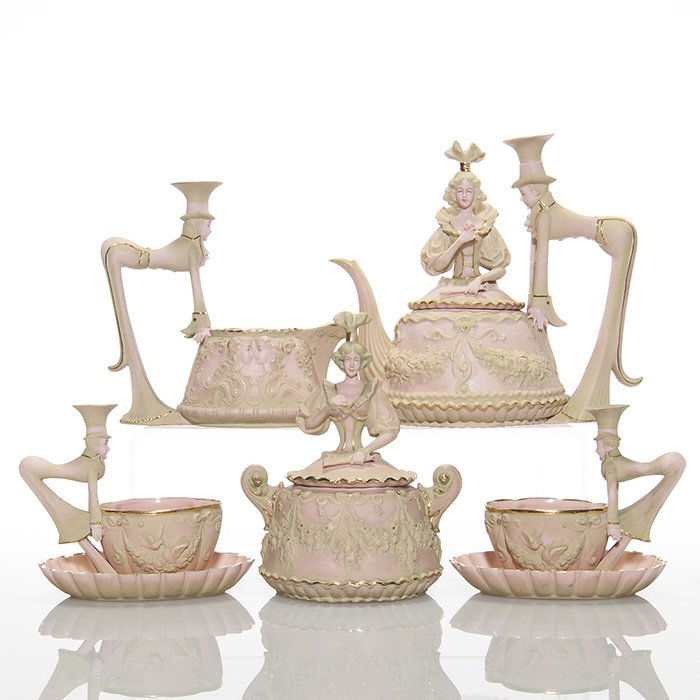 Schafer & Vater “Mad Hatter” tea set, 6 1/2”: Amazing Schafer & Vater “Mad Hatter” tea service consisting of teapot, creamer, sugar bowl and two cups and saucers. The lids of the sugar bowl and the teapot are topped with an elaborately dresse