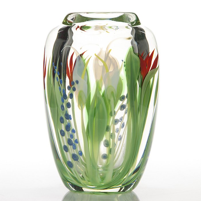 Orient & Flume paperweight vase, Beyers, 8 1/2”: Good Orient & Flume paperweight vase constructed by Scott Beyers layering growths of red Bird of Paradise, white Calla Lilies and stalks of blue flowers among some foliage. Height 8 1/2 inches. Marked