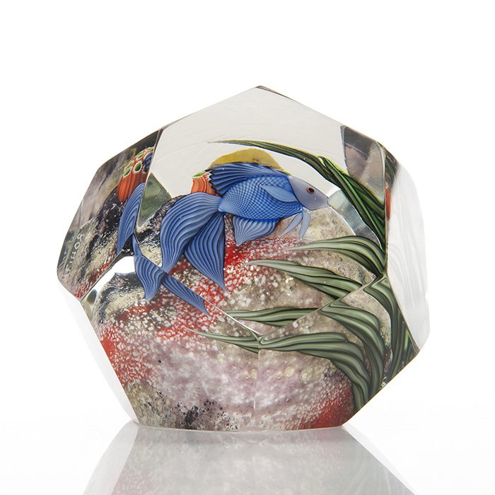 Faceted Orient & Flume paperweight, Beyers, 2 3/4”: Faceted Orient & Flume paperweight displaying within a bright blue fish investigating a coral reef, a creation by Scott Beyers. Measures 2 3/4 inches by 3 inches. The comany name is engraved beneath a