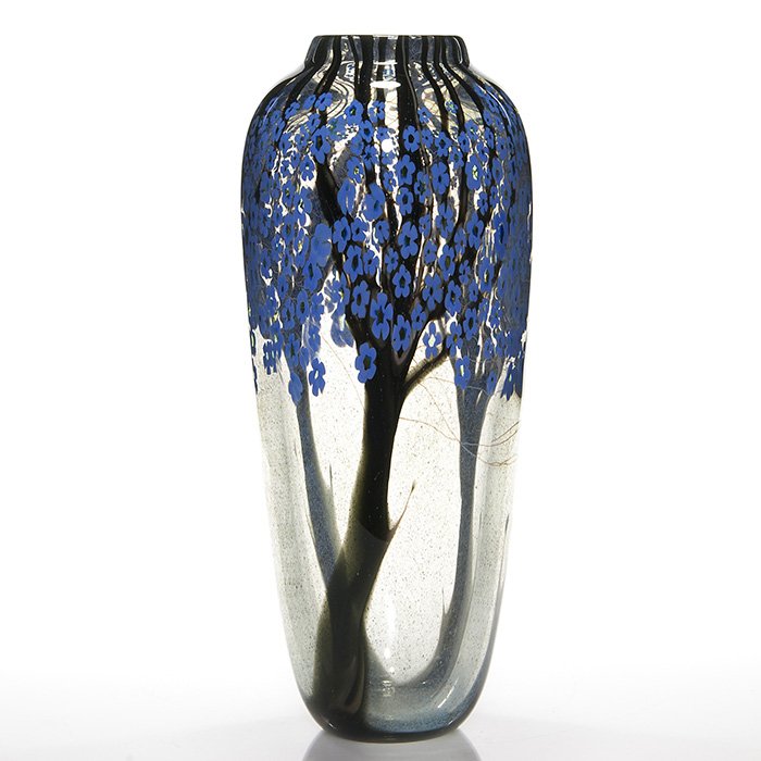 Tall Orient & Flume “flowering tree” vase, 15”, Sillars: Early Orient & Flume vase, a Bruce Sillars creation displaying a trio of mature trees, their branches bountiful with blue millefiori flowers. The transparent glass is mottled with tiny specks of blue,