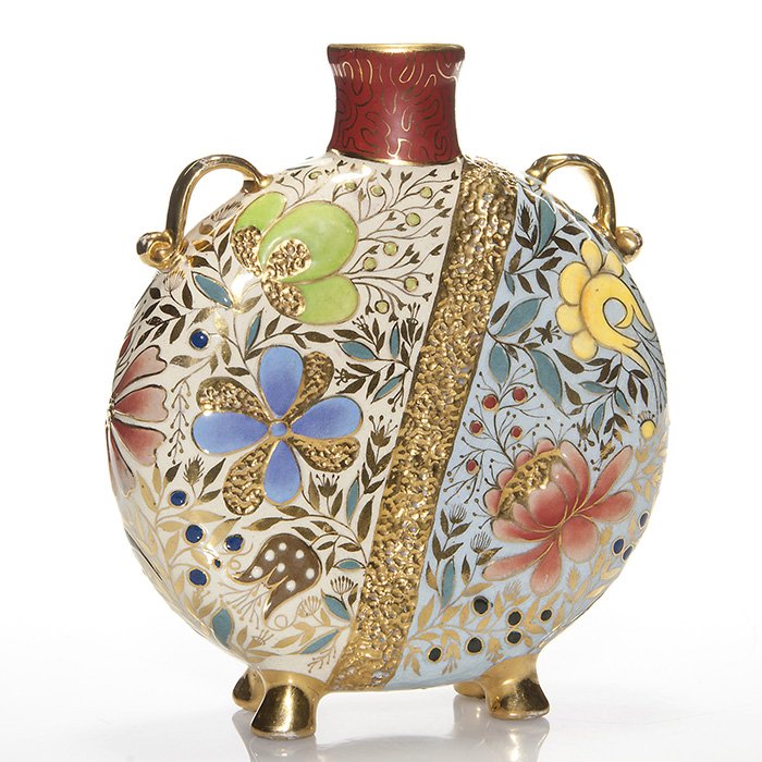 William Dell Hungarian Faience flask, 8 5/8”: William Dell Pottery 8 5/8 inch twin handled flask, made 1891-2, decorated in the Hungarian Faience style with a variety of flowers and leaves and accented with gold trim. Marked on the bottom Wm. Del