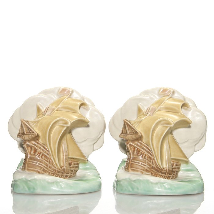 Polychromed Rookwood ship bookends, 1943: Pair of Full Sail Ship bookends, a William McDonald design, cast in 1943 and polychromed in four mat glazes. Marks include the Rookwood logo, date, shape 2695 and Mr McDonald’s mold monogram. Height